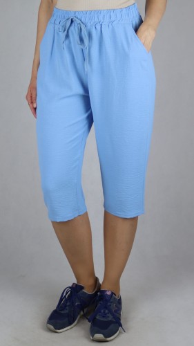 Spodnie damskie 3/4 rybaczki luźne kieszenie duże rozmiary jasno niebieski