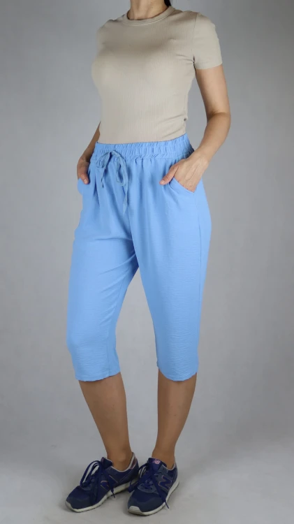 Spodnie damskie 3/4 rybaczki luźne kieszenie duże rozmiary jasno niebieski