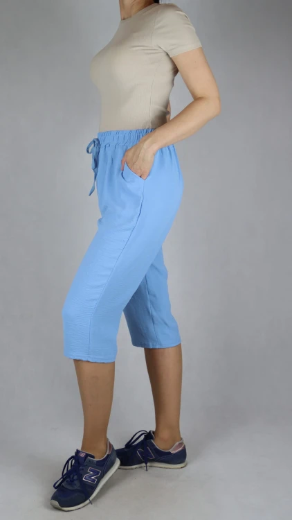 Spodnie damskie 3/4 rybaczki luźne kieszenie duże rozmiary jasno niebieski