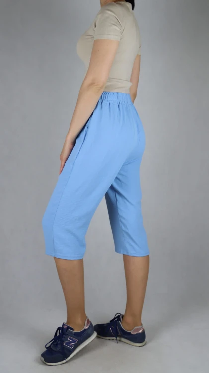 Spodnie damskie 3/4 rybaczki luźne kieszenie duże rozmiary jasno niebieski