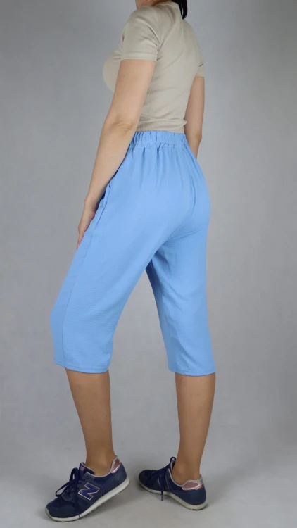 Spodnie damskie 3/4 rybaczki luźne kieszenie duże rozmiary jasno niebieski